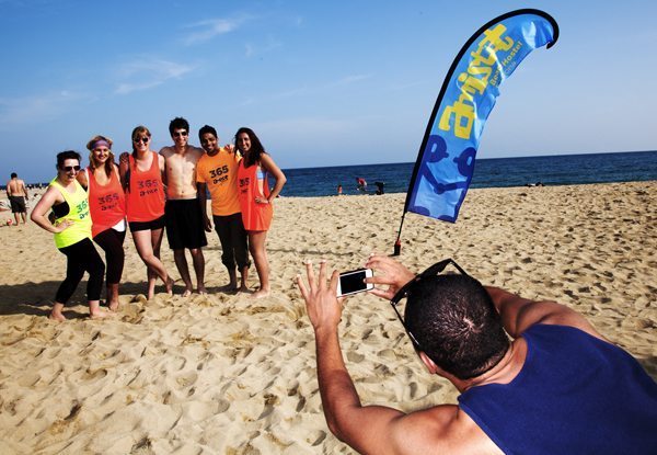 Posing after beach sport activities.Picture source:amistatbeachhostel.com